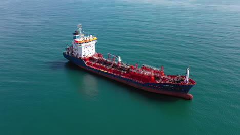 Close-up-aerial-shot-over-a-oil-tanker-petroleum-ship-moving-gasoline